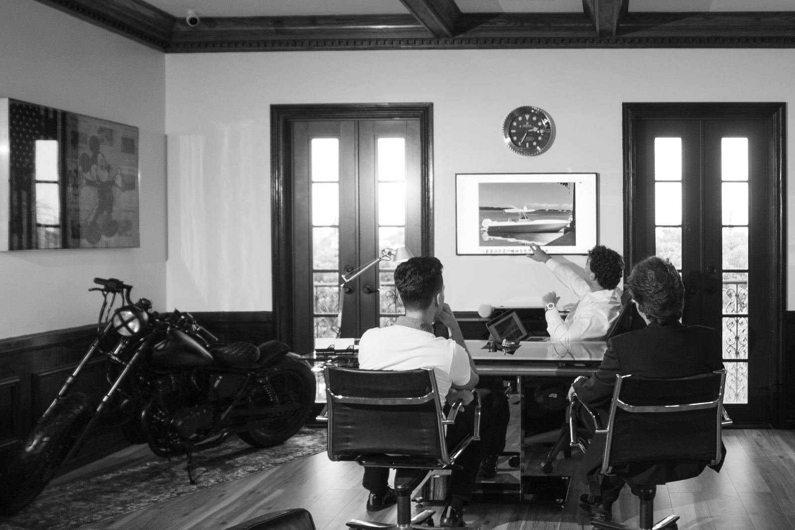 Reviewing an asset over the desk at the ASSETHAUS office
