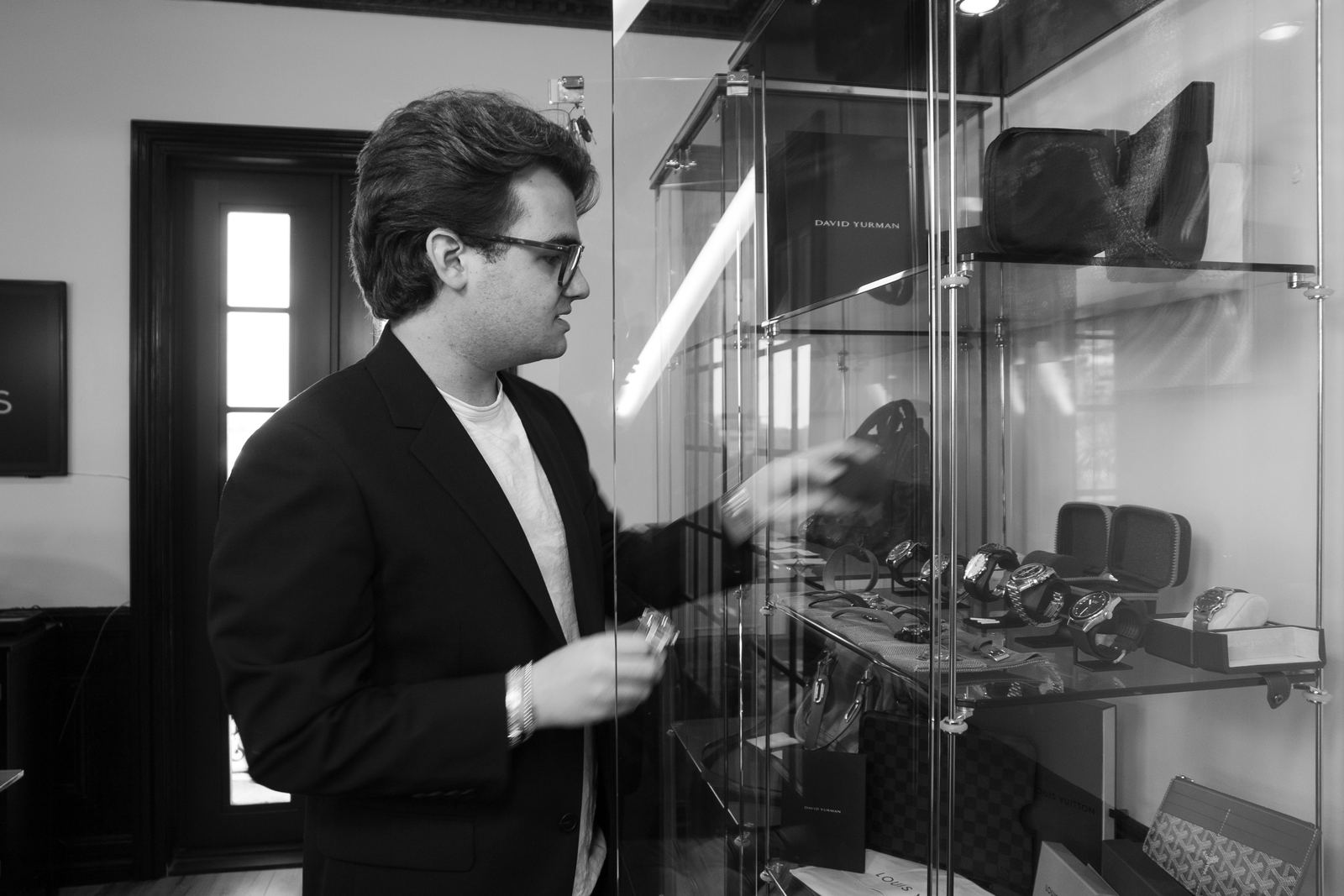 The ASSETHAUS showroom case of watches and designer bags